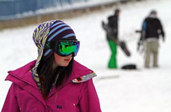 girl snowboarder at mt. holly in michigan portrait