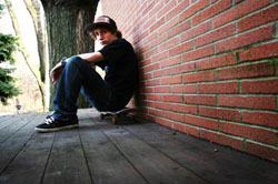 self portrait robbie small sitting on a skateboard in bloomfield hills michigan