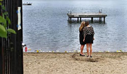 oliver smith's mother and girlfriend at the memorial at wing lake beach in bloomfield hills michigan